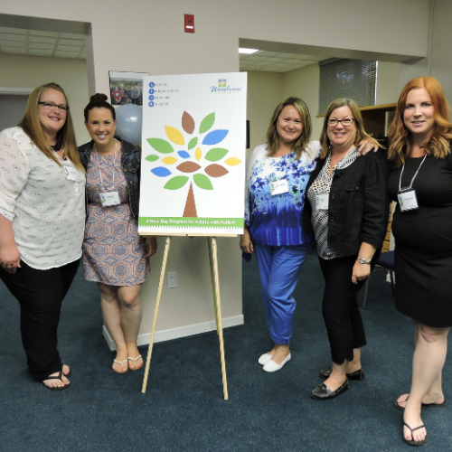 agency staff members at grand opening event